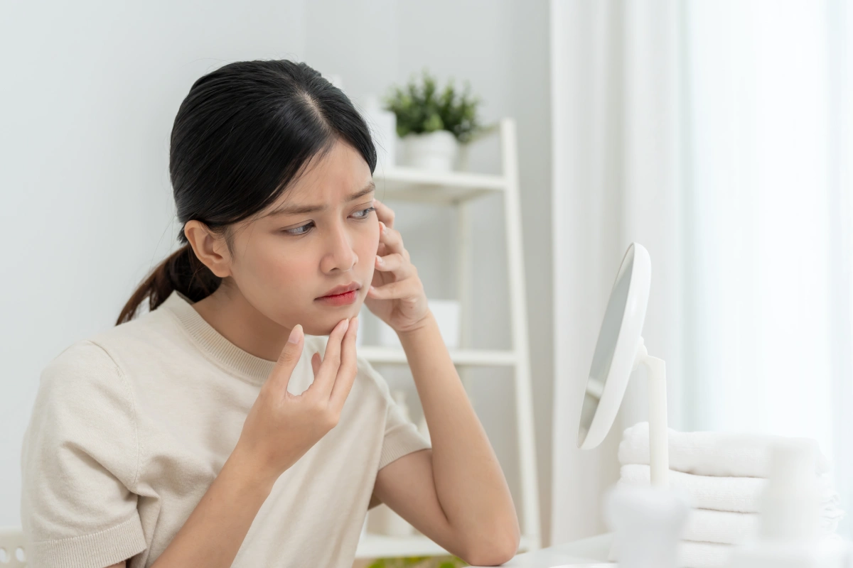 Woman with fine lines considering Botox for early facial aging.