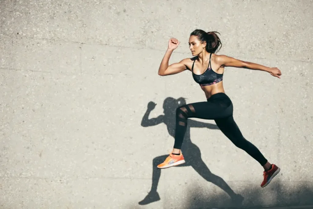 Athletic woman running in motion, symbolizing energy and vitality after Peptide Therapy for sexual wellness.