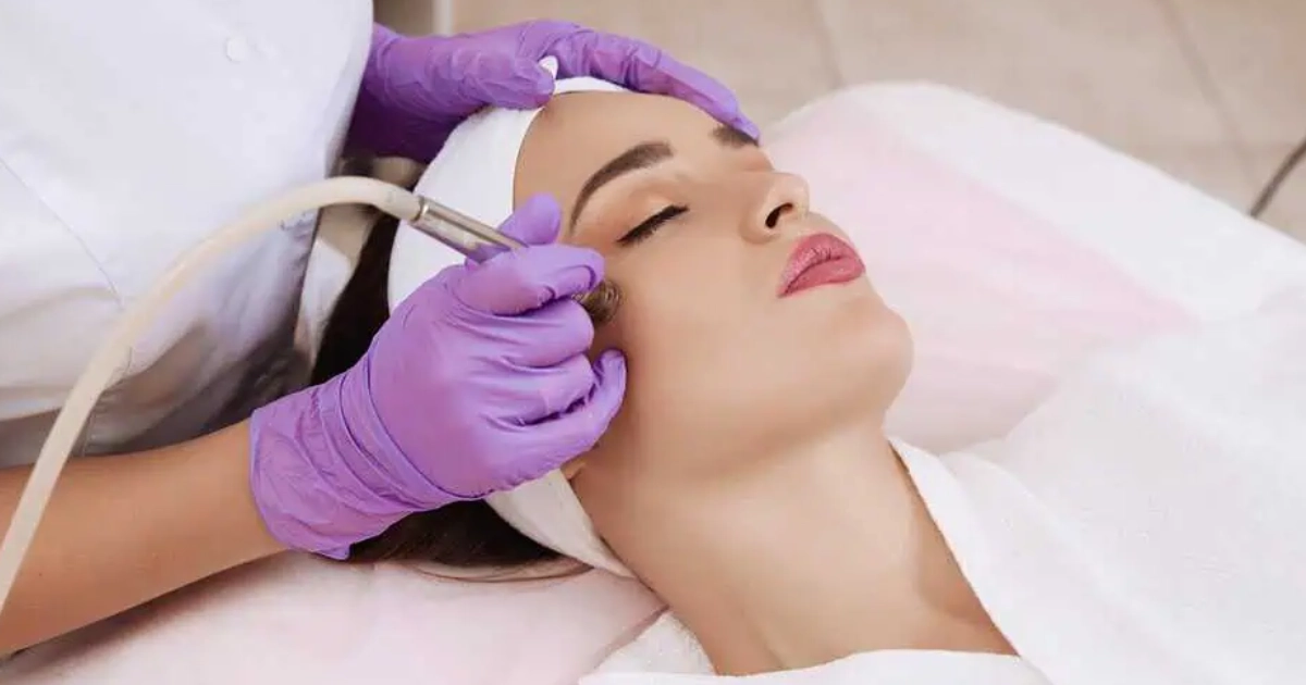 Woman receiving a microdermabrasion facial at a dermatology clinic in Sioux Falls, SD