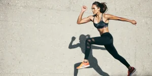 Athletic woman running in motion, symbolizing energy and vitality after Peptide Therapy for sexual wellness.